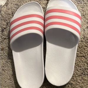 White and pink adidas slippers